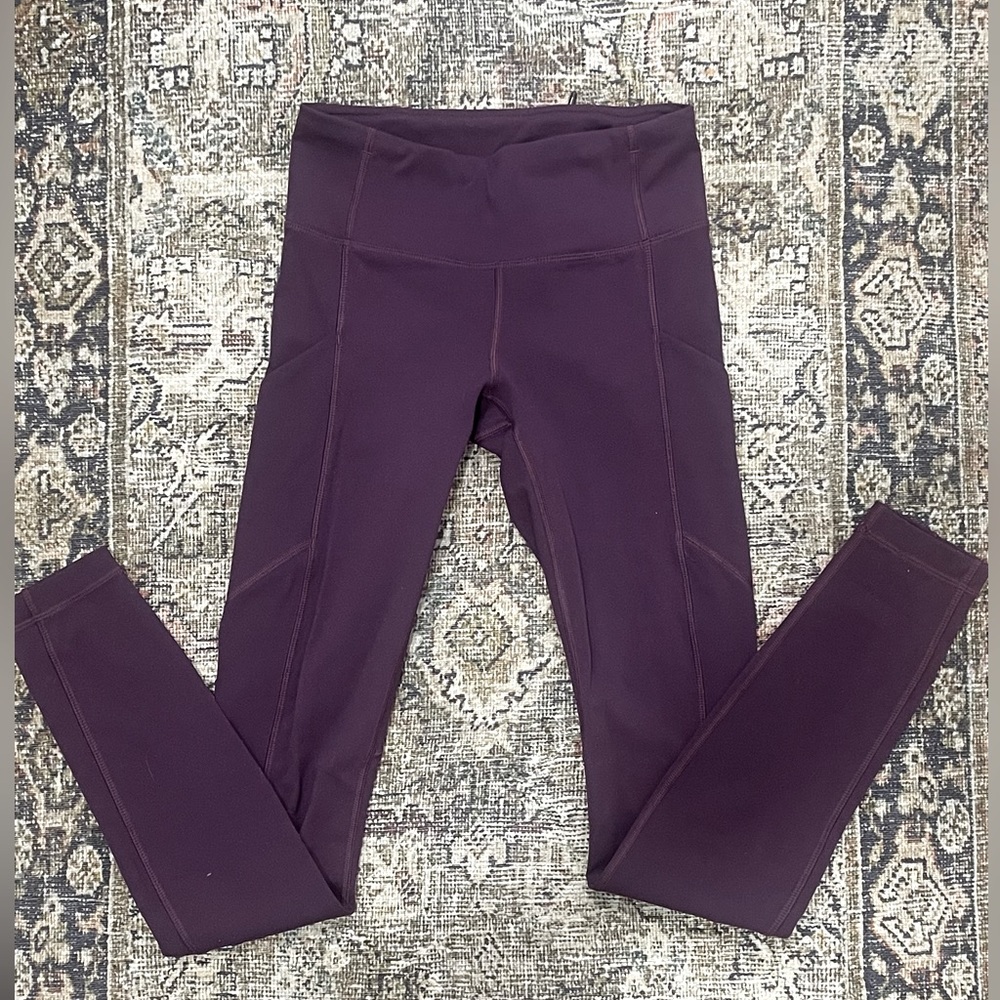 Lululemon Purple leggings w/ side pockets size 2